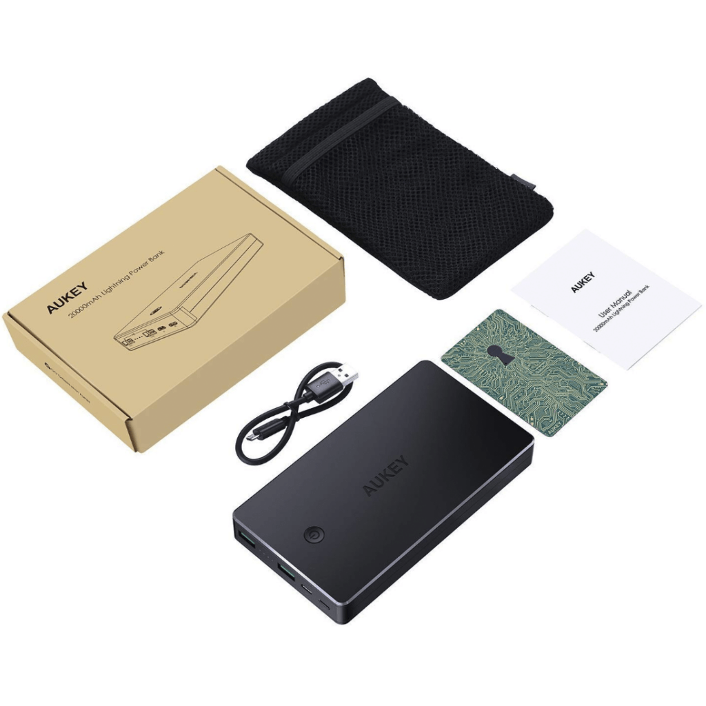 Various items displayed including an AUKEY portable charger, box, carrying pouch, cables, and instruction cards.