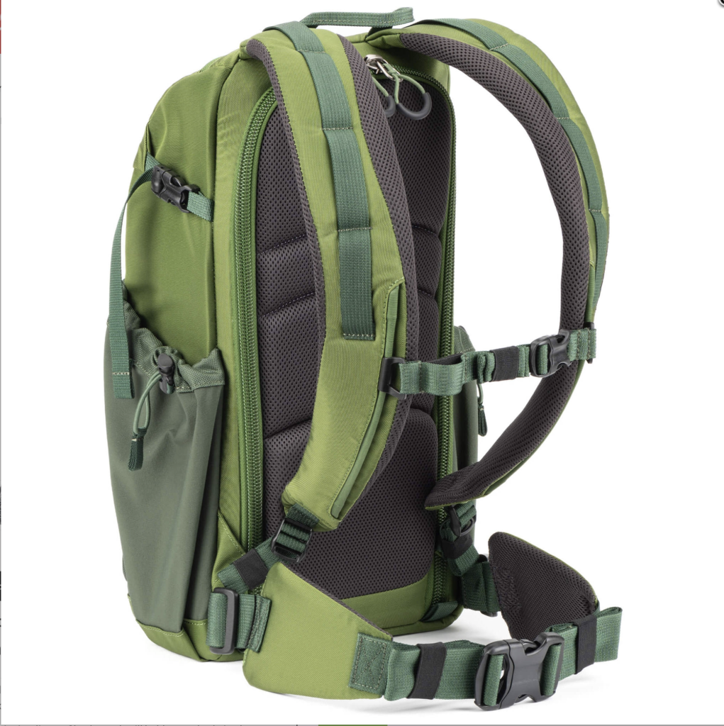 A green outdoor backpack suitable for hiking with multiple compartments and adjustable straps, pictured on a white background.